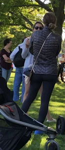 Sexy fit milf in black leggings at the park