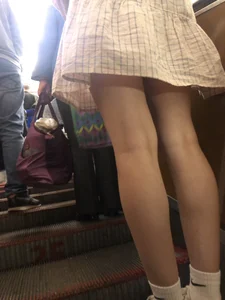 Cute Girl in a Dress with Thin Hot Legs Standing on the Subway Escalator Closeup Creepshots Gallery