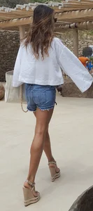 Flat ass leggy girl in denim shorts