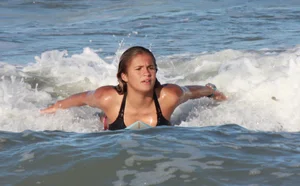Hot surfer chicks out in the water