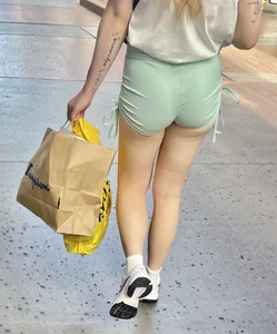 Sexy blonde in green shorts