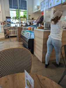 Tiny Latina waitress in tight jeans with cake