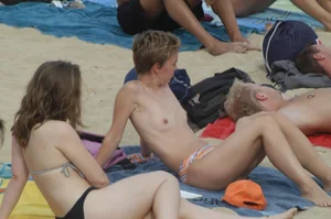 Topless girls on a beach in Barcelona