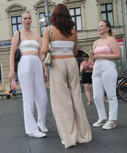 Long blonde braless in a white outfit (many pictures)