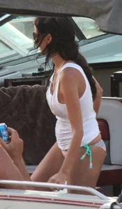 Bikini babe on a boat with a wet see through white shirt showing her tits