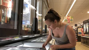 Thick girl showing cleavage while downbloused at the market