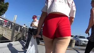 Red short shorts teen cheeks out. walking in mall