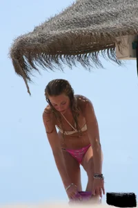 Hot beach girl undressing and going topless