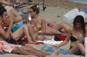 Topless girls on a beach in Barcelona