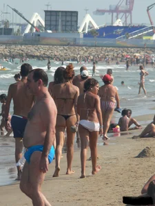 Bunch of sexy babes at the beach in thong bikinis