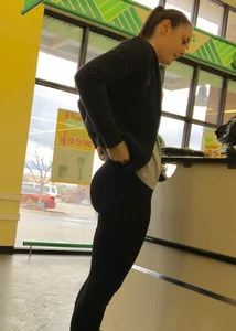 Thick booty girl shopping at Dollar Tree in leggings