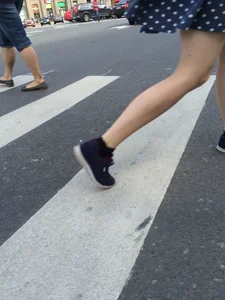 Girl in Polka-Dot Skirt with Pale Legs Crossing the Street City Candid