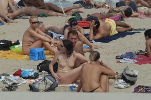 Topless girls on a beach in Barcelona