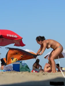 2 topless thonged sexy friends on the beach with great bodies