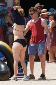 Girls in bikinis getting ready for tubing