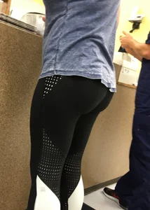 Nice round ass in leggings in line with no face