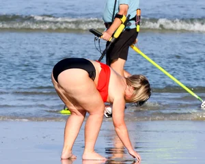 Thick BBW blonde lady in a bikini at the beach