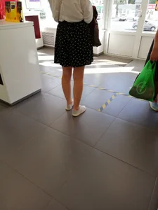Girl in a Skirt With Nice Thin Legs Creepshot at the Store