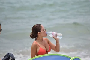 Two sexy ass girls on the beach in bikinis