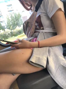 A Cute And Skinny Teen Candid Girl in Shorts Sitting With Crossed Legs in a Public Bus Creepshots Series