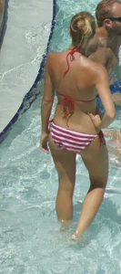 Blonde babe at the pool with sexy body in USA bikini