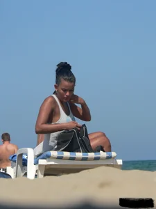Hot ass topless beach girl with great tits lets her little brother oil up her ass in thong bikini