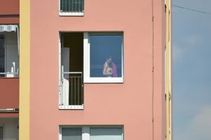Peeping Tom pics of a topless girl in her house with nice tits