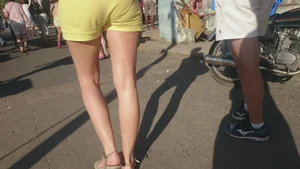 Milf in yellow shorts with vpl and a wedgie