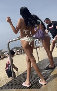 Skinny girl in a swimsuit at the beach