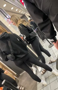 Tight ass sports team in line at airport
