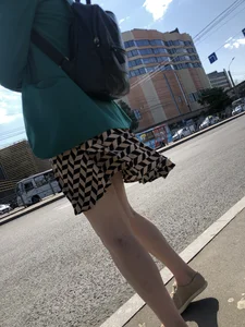 Candid milf wearing a dress crossing the street, nice legs