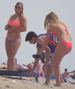 Sexy thick blonde girl with tiny bikini and big booty on the beach