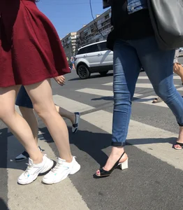Girl in a Skirt with Sexy Skinny Legs on the Crosswalk Candid Photos