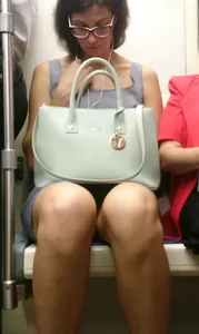 Bespectacled Milf in Subway with Skinny Legs Creepshot