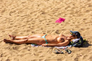Topless milf at the beach