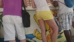 Milf in yellow shorts with vpl and a wedgie