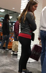 Pretty girl shopping with boyfriend in leggings with a nice ass