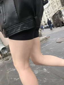 Very hot legs of a candid girl wearing a leather jacket