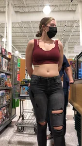 Latina in Maroon crop top and tight black jeans