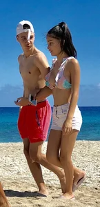 Beautiful brunette teen babe on the beach with a perfect body
