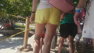 Milf in yellow shorts with vpl and a wedgie