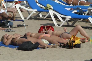 Girls on a nude beach in Sitges, Spain