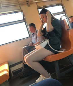 Amazing Hot Girl Sitting in the Train in Shorts Showing Off Her Gorgeous Legs Candid Gallery