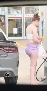 Milf with ass cheeks hanging out of her shorts at the gas station