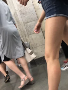 Tall Candid Teen Girl in Denim Shorts And Sandals Sitting in the Subway Train, Then Walking Down the Station