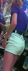 Cute skinny girl shopping in white denim shorts