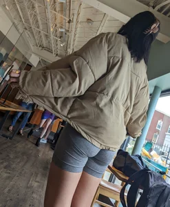 Slender asian teen oblivious at the cafe