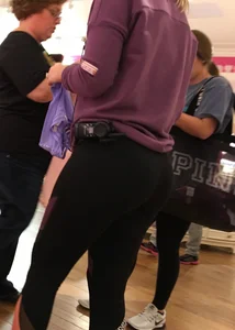 Pink employee with a perfectly round ass in leggings