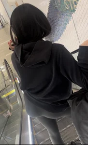 Tight curvy latina at airport pulls up pants