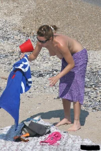 A bunch of sexy beach voyeur babes in bikinis, thongs and topless